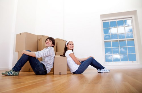 Family packing boxes for a home move in Storage Bow