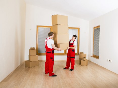 Unpacking professionals setting up a new home